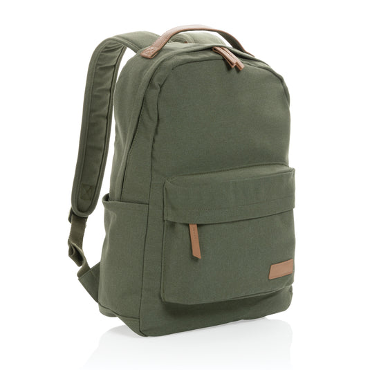 16 oz recycled canvas backpack by XD Collection, showing adjustable shoulder straps and front pocket in a natural setting.