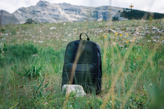 XD Xclusive Impact AWARE™ RPET 15.6-inch laptop backpack with multiple compartments and padded straps for comfortable carrying.