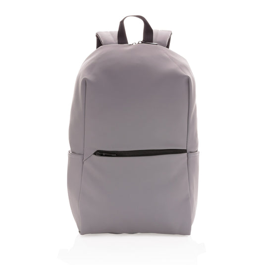Smooth PU 15.6-inch laptop backpack from XD Collection, featuring multiple compartments and padded shoulder straps for travel.