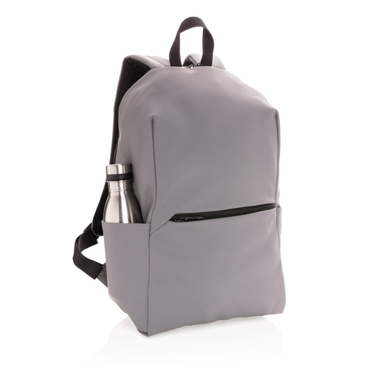 XD Collection Smooth PU 15.6-inch laptop backpack with multiple compartments, padded shoulder straps, and sleek design for travel and daily use.
