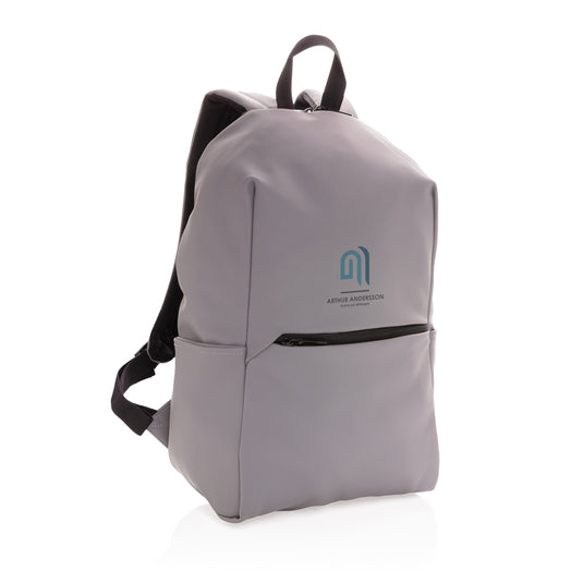 Smooth black PU laptop backpack for 15.6-inch laptops from XD Collection, featuring multiple compartments and adjustable straps.