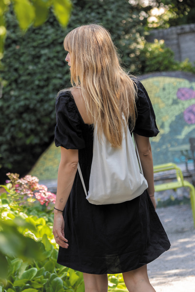 Load image into Gallery viewer, Recycled cotton drawstring backpack by XD Collection in impact AWARE™ style, lightweight and eco-friendly for travel and daily use.
