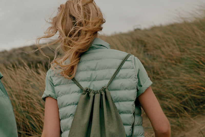Load image into Gallery viewer, Recycled cotton drawstring backpack from XD Collection Impact AWARE™, lightweight and eco-friendly for travel and daily use.
