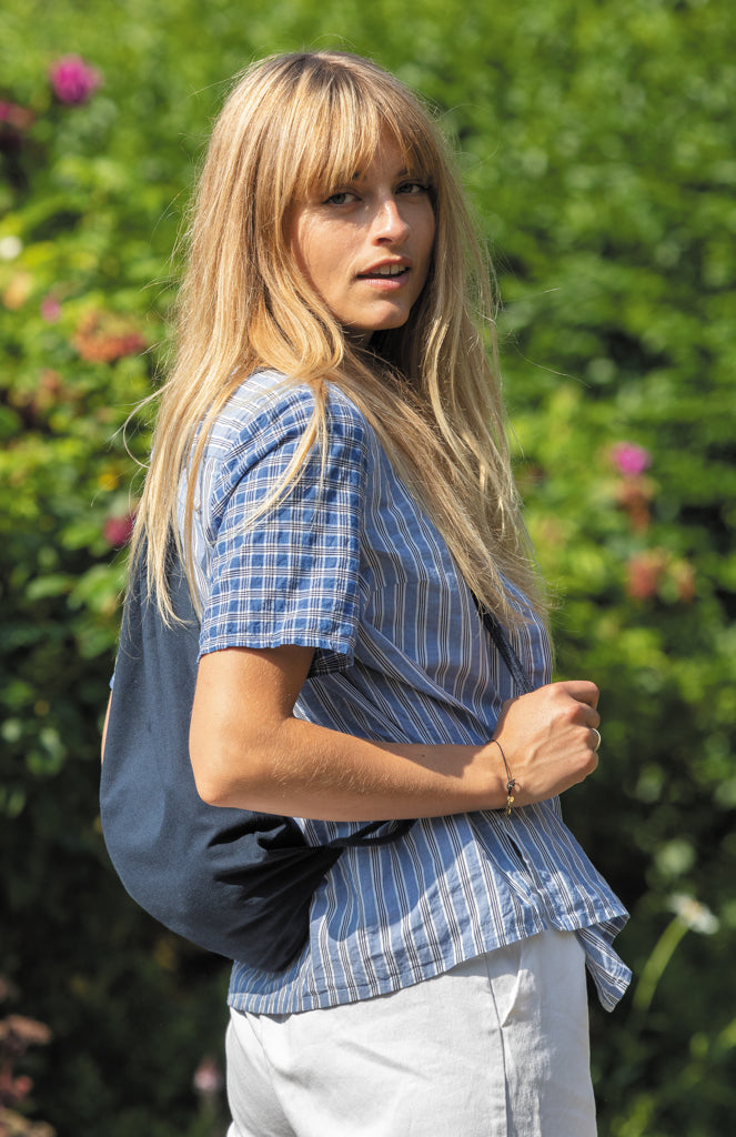Load image into Gallery viewer, Recycled cotton drawstring backpack by XD Collection from Impact AWARE™ in gray, showing adjustable drawstrings and spacious interior.
