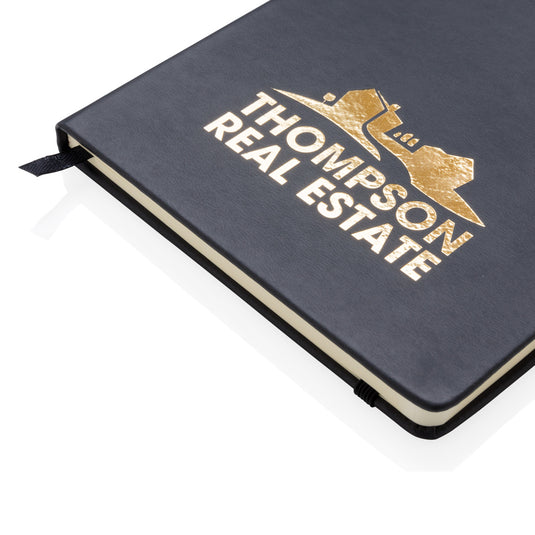 Deluxe hardcover PU A5 notebook from XD Collection with a sleek black cover and gold accents, ideal for writing and note-taking.