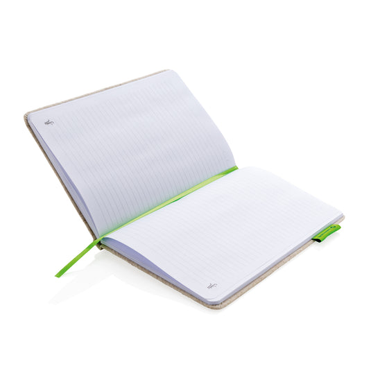 A5 jute notebook from XD Collection featuring a natural woven cover and compact size, ideal for note-taking and journaling.