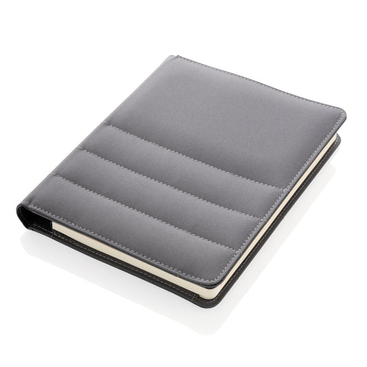 Impact AWARE™ RPET A5 notebook by XD Xclusive with eco-friendly recycled plastic cover and lined pages inside.