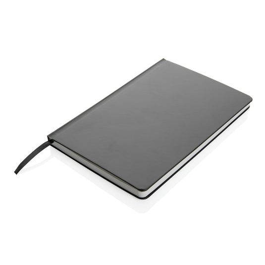 A5 Impact stone paper hardcover notebook from XD Collection with black cover and lined pages for writing and note-taking.