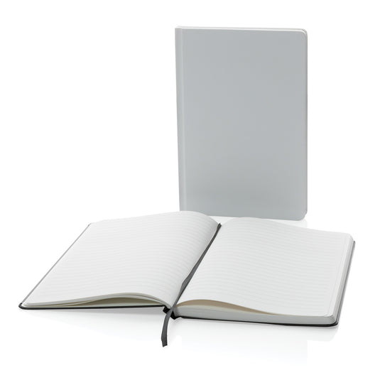 A5 Impact stone paper hardcover notebook by XD Collection, featuring a durable black cover and compact size for note-taking.