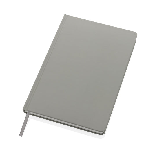 A5 Impact stone paper hardcover notebook from XD Collection with black cover and blank pages, ideal for note-taking and journaling.