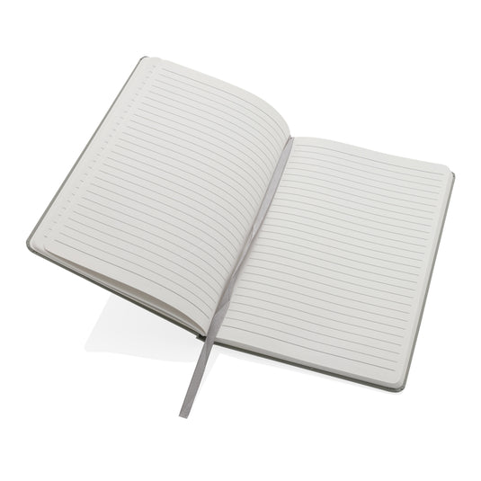 A5 Impact stone paper hardcover notebook by XD Collection, featuring a sleek black cover and visible elastic closure.