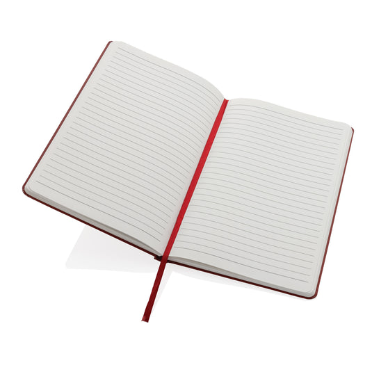 A5 Impact stone paper hardcover notebook from XD Collection with a sleek black cover and visible binding, ideal for note-taking.