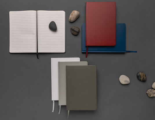 A5 Impact stone paper hardcover notebook by XD Collection with a sleek black cover and blank pages for writing or note-taking.