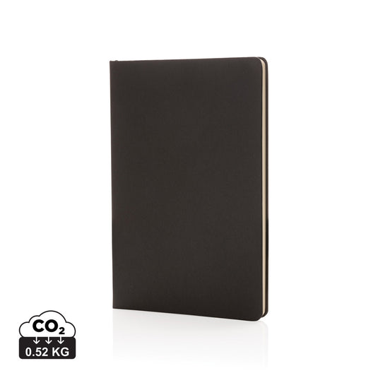 A5 hardcover notebook from XD Collection with a sleek black cover, open to show lined pages and elastic closure.