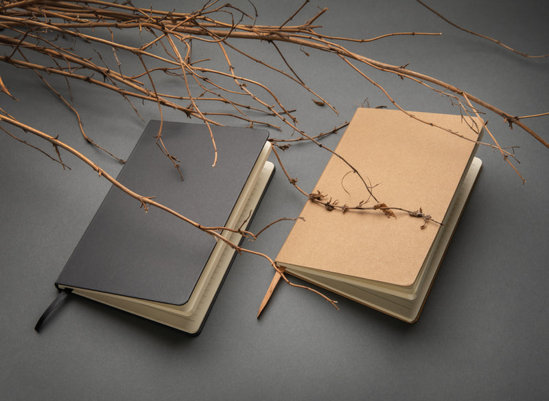 Load image into Gallery viewer, A5 hardcover notebook by XD Collection with a sleek black cover and visible binding, perfect for writing or note-taking.
