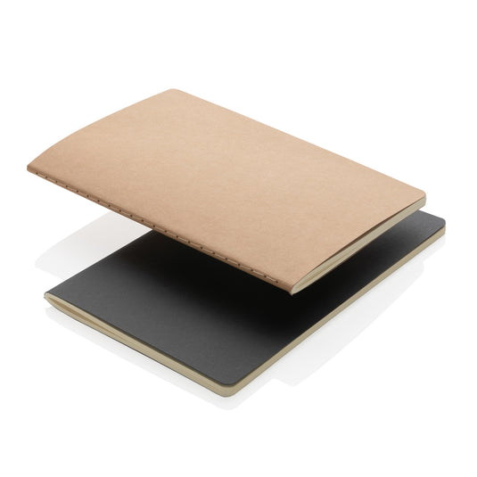 A5 softcover notebook from XD Collection with a plain cover and open pages, ideal for writing or note-taking.
