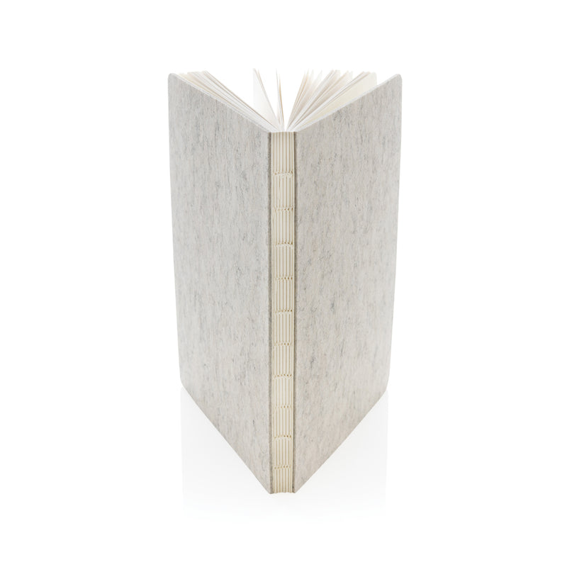 Load image into Gallery viewer, Recycled felt A5 notebook by XD Collection with GRS certification, showing its eco-friendly textured cover and compact size.

