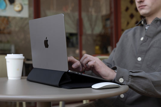 XD Design 14-inch mobile office sleeve showing sleek black fabric with padded interior for laptop protection.