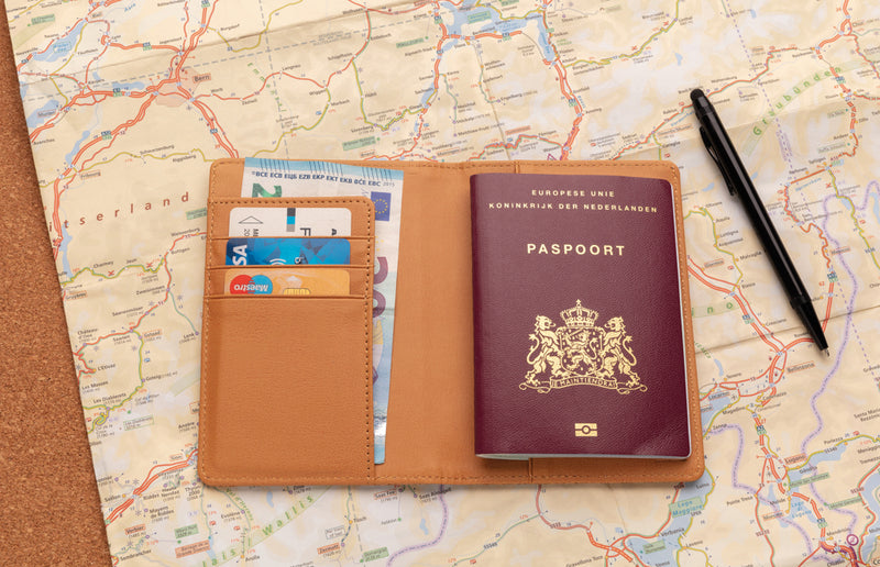 Load image into Gallery viewer, Black cork RFID passport cover from XD Collection with secure slots for passport and travel documents.
