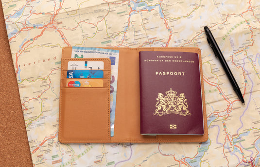 Black cork RFID passport cover from XD Collection with secure slots for passport and travel documents.