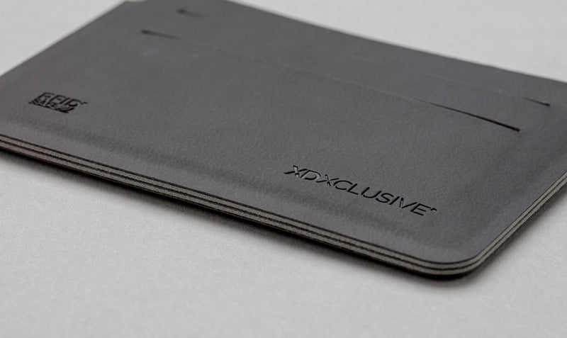 Load image into Gallery viewer, Black Quebec RFID safe cardholder by XD Xclusive with multiple card slots, designed for secure travel and everyday use.
