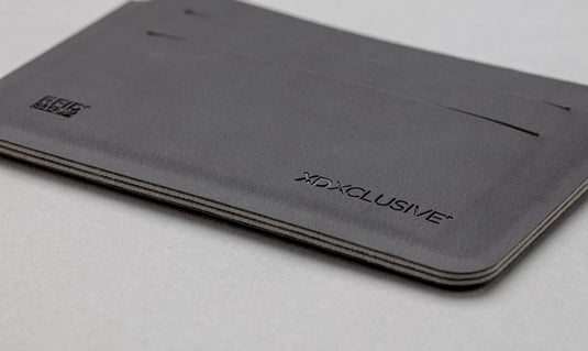 Black Quebec RFID safe cardholder by XD Xclusive with multiple card slots, designed for secure travel and everyday use.