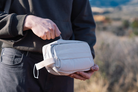 XD Xclusive Armond AWARE™ RPET toiletry bag in eco-friendly recycled fabric with zipper closure and compact travel design.