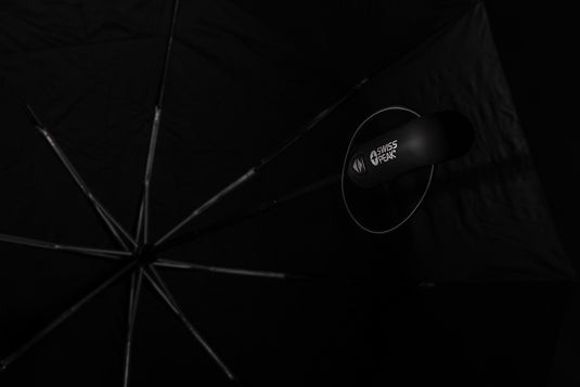 Swiss Peak Tornado 27-inch pocket storm umbrella open, showing sturdy canopy and compact design for travel and rain protection.