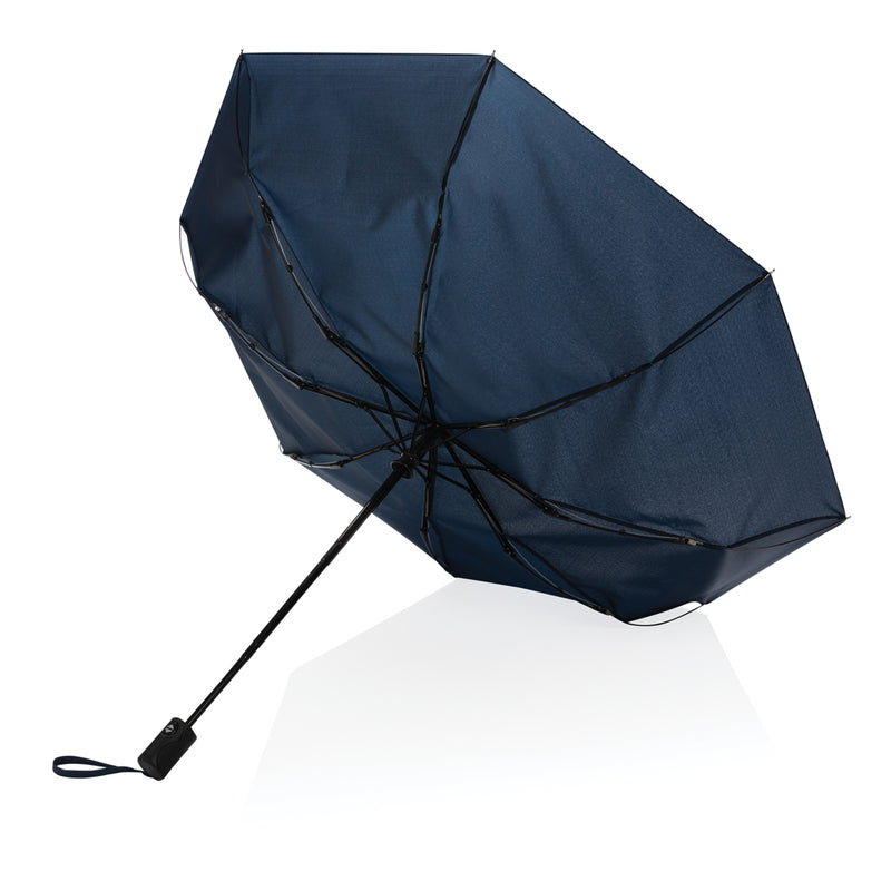 Load image into Gallery viewer, 21-inch XD Collection Impact AWARE™ RPET auto open/close umbrella with blue canopy and sturdy handle, outdoors on a cloudy day
