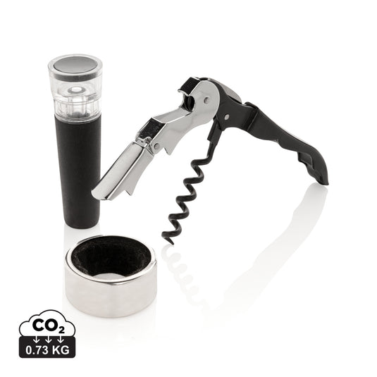 XD Collection Vino Sommelier 3-piece set with corkscrew, wine stopper, and foil cutter on a wooden surface for home wine tasting.