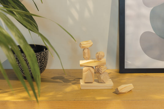Ukiyo Crios wooden balancing rocks set in pouch, featuring natural wood stones for home décor and balancing play.