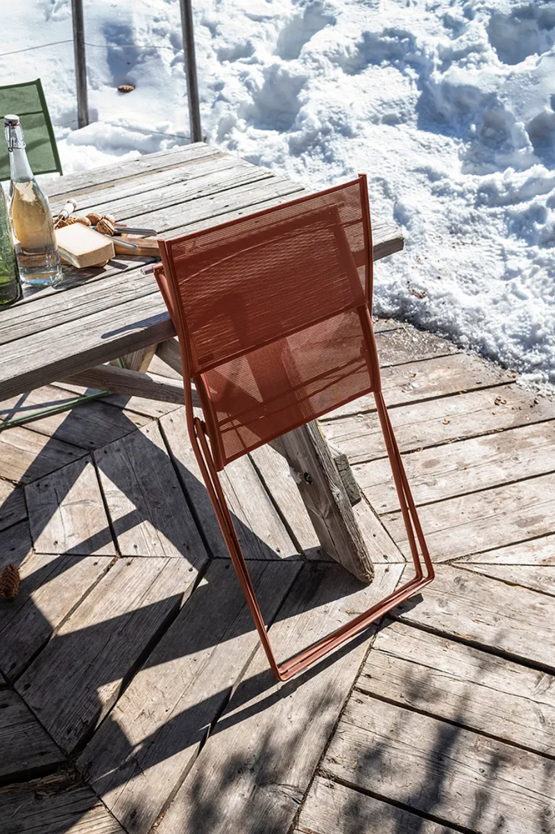 Load image into Gallery viewer, Fermob Plein Air Chair OTF folding outdoor chair with a colorful woven seat and metal frame, ideal for patio or garden use.
