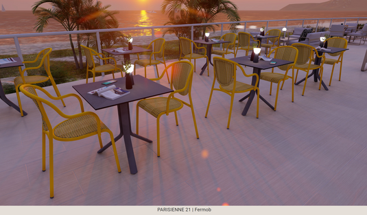 Yellow Fermob Parisienne 21 steel bistro chair for outdoor use, featuring a classic metal design and slender legs.