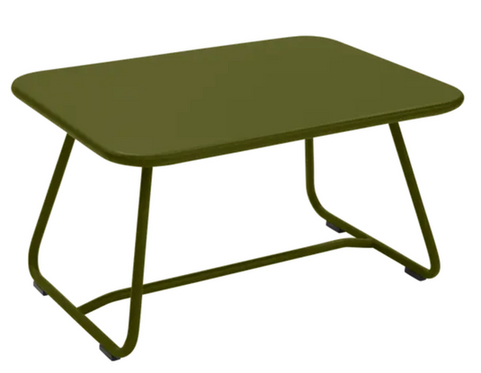 Fermob Sixties low outdoor table, 76x55.5cm, featuring a sleek design and vibrant Pesto color, ideal for patio or garden use.