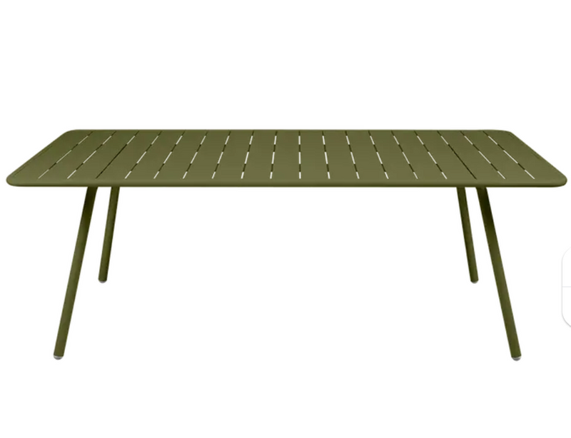 Load image into Gallery viewer, Fermob Luxembourg outdoor table, 207x100 cm, shown in a garden setting with a sleek, modern design perfect for outdoor dining.
