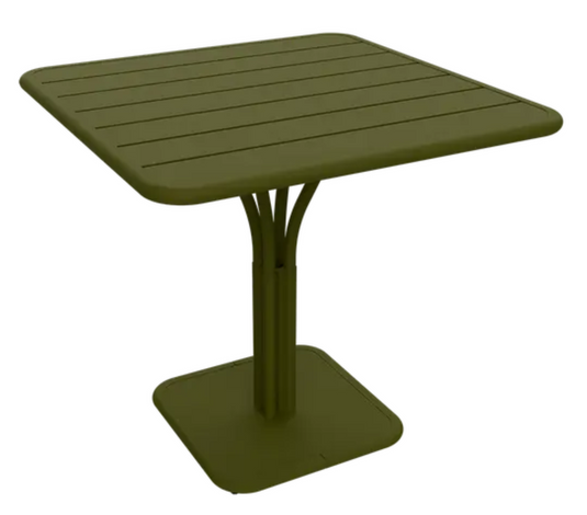 White Luxembourg Fermob outdoor pedestal table measuring 80x80 cm, with a sleek, modern design ideal for outdoor spaces.