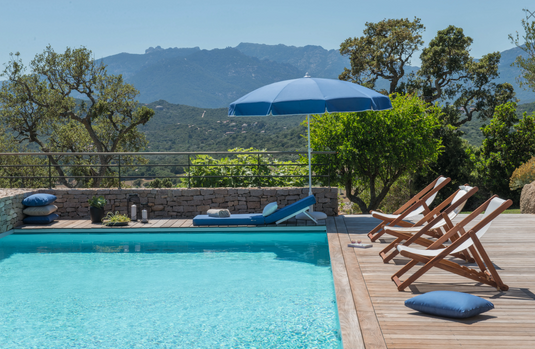 Fermob IBIZA teak deckchair with slatted design, outdoor seating furniture, perfect for relaxing on patios or decks.