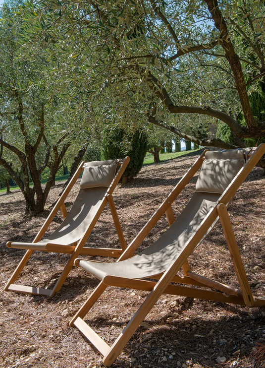 Fermob IBIZA teak deckchair with woven seat and backrest, sturdy wooden frame, perfect for outdoor lounging or patio relaxation.