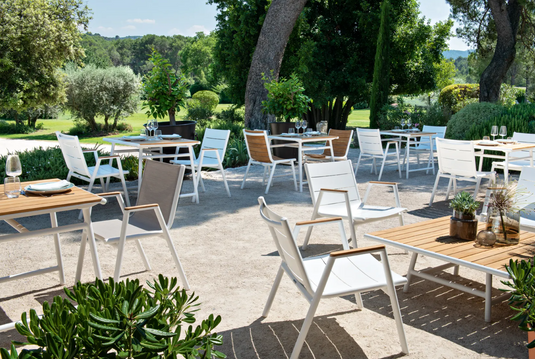 Fermob Pilotis V aluminum low armchair with teak seat, outdoor restaurant furniture, lightweight and modern design.