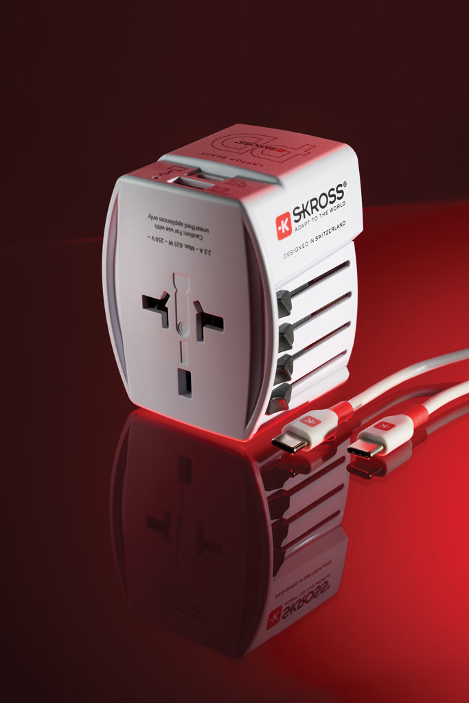 Load image into Gallery viewer, Skross SKROSS World Travel Adapter MUV 65W PD with USB-C cable for phone and tablet charging, compact international power adapter.
