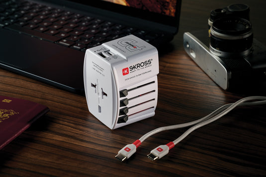 Skross SKROSS World Travel Adapter MUV 65W PD with USB-C cable for phone and tablet charging, compact travel power adapter.