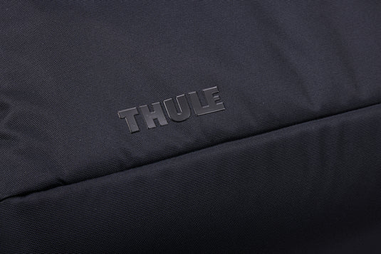 Thule Subterra 2 Duffel 35L in black, showing the durable fabric, shoulder strap, and spacious main compartment for travel and storage.