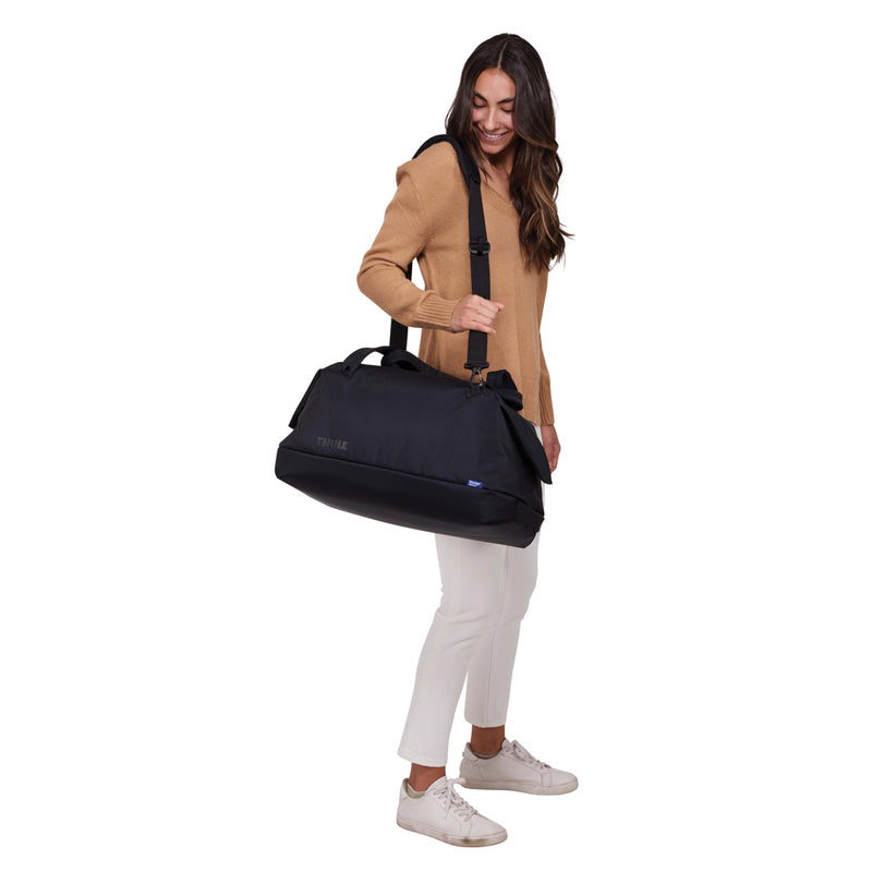 Load image into Gallery viewer, Thule Subterra 2 Duffel Bag in black with 35L capacity, featuring durable fabric and carry handles for travel and storage.
