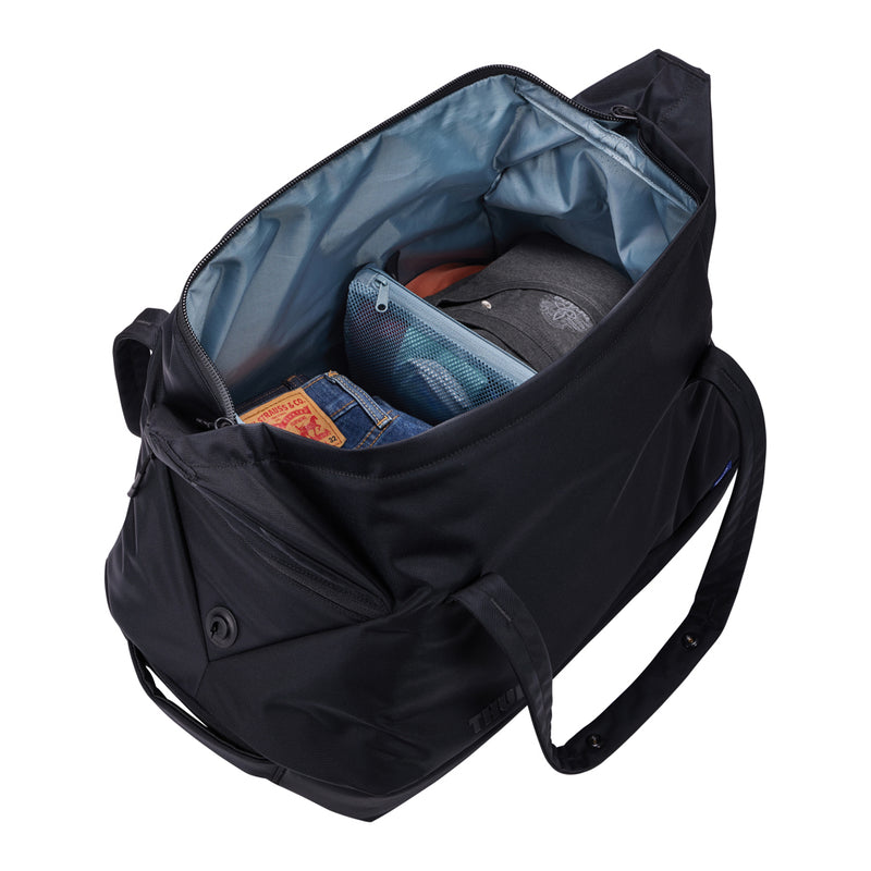 Load image into Gallery viewer, Thule Subterra 2 Duffel 35L in black, durable travel bag with carry handles and shoulder strap, designed for versatile travel needs.
