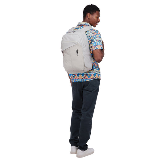 Thule Indago 23L backpack in black with multiple compartments for travel and daily use, featuring padded shoulder straps.