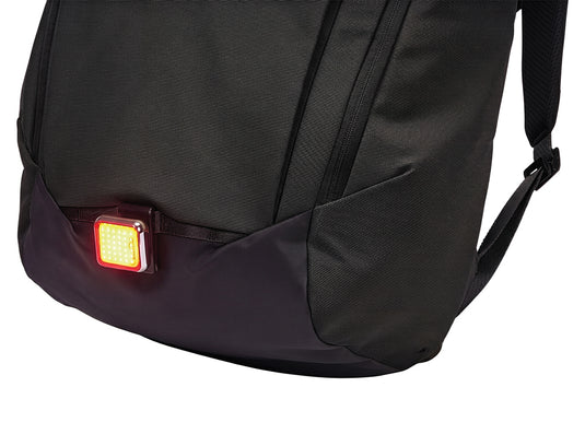 Thule Paramount 20L backpack in black with multiple compartments and padded shoulder straps, designed for travel and daily use.