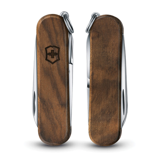 Victorinox Pocket Knife Classic SD Wood with five functions, showing a compact multi-tool with wooden handle and open blades.