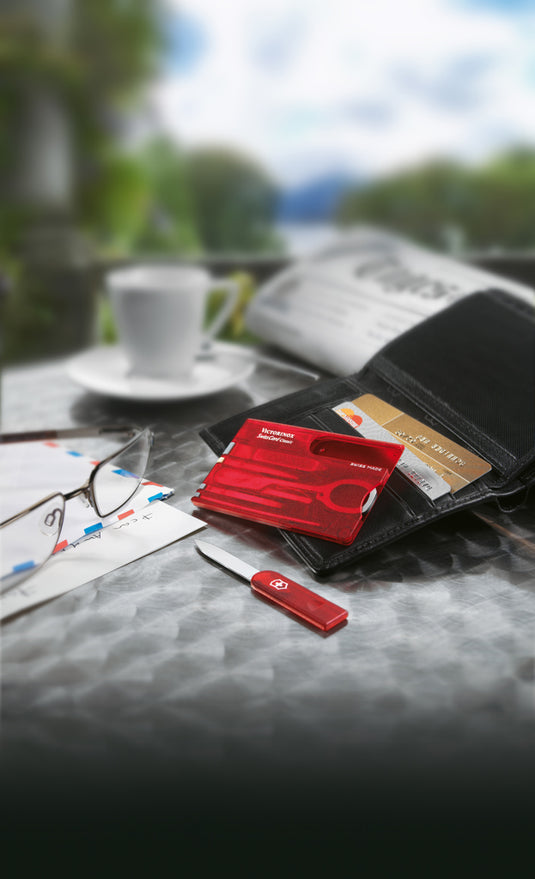 Victorinox Swiss Card Classic multi-tool with 10 functions, compact plastic case showing various integrated tools and blades.