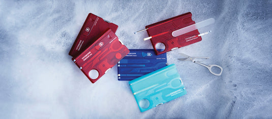 Victorinox Swiss Card Classic with 10 functions, compact multi-tool featuring scissors, blade, screwdriver, and more on a white background.