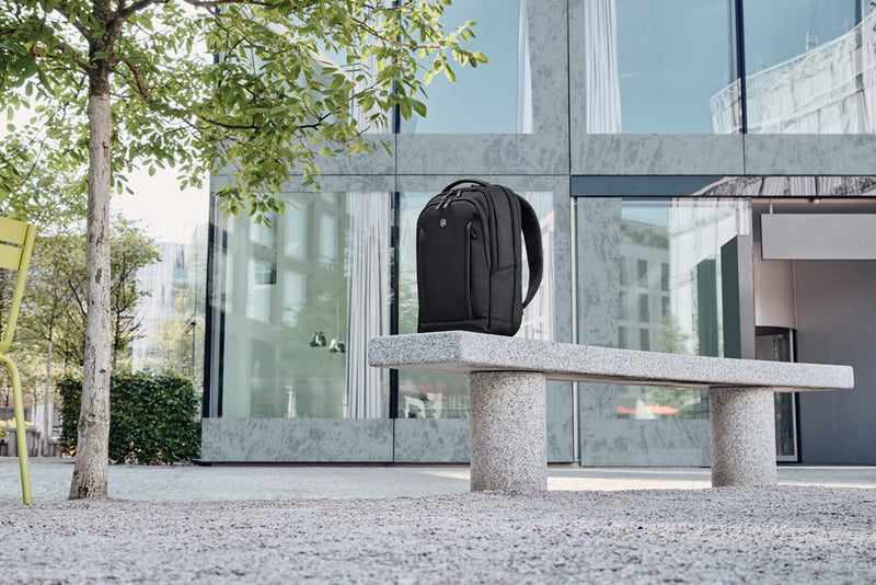 Load image into Gallery viewer, Victorinox Altmont Professional compact laptop backpack with padded compartments and multiple zippered pockets, black nylon material.
